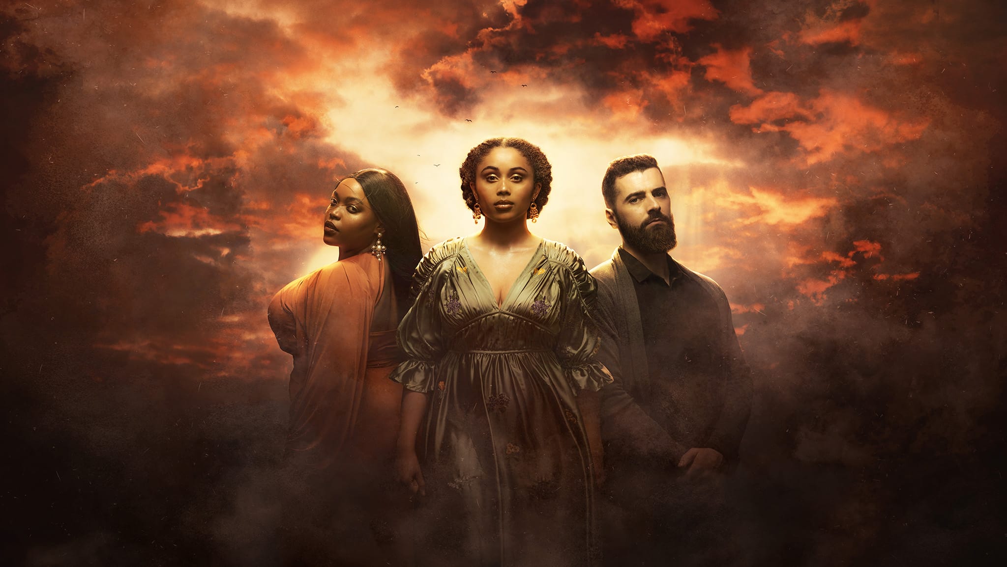 Three members of the cast stand in dramatic lighting against a cloudy, orange-lit sky: two women in ornate dresses, evoking Queen of the Fight, and a bearded man in dark clothing reminiscent of James IV.