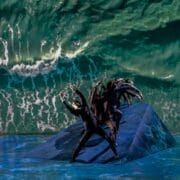A group of dancers from Mod Ballet performs on a sloped platform, with a large projection of ocean waves as the background—a scene reminiscent of Quadrophenia’s seaside atmosphere.