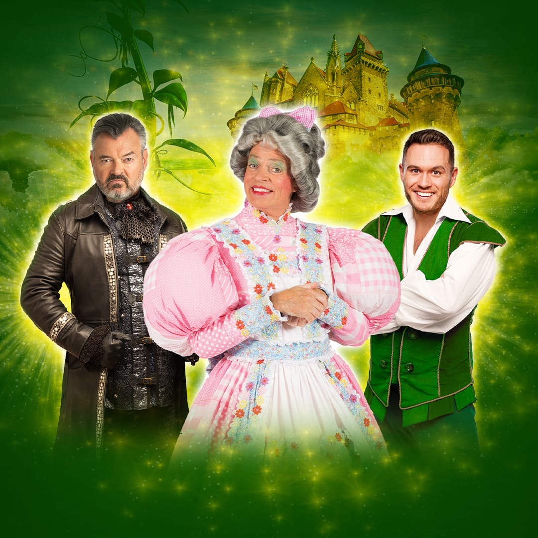 Three people in costume pose in front of a fantasy castle backdrop; one as a villain, one as a grandmother, and one as Jack from the fairy tale Jack And The Beanstalk, bringing this beloved children's story to life.
