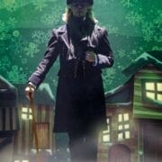 A person in Victorian-era clothing and top hat holds a cane, standing on stage with a backdrop of snowflakes and illustrated buildings—capturing the spirit of a Christmas Carol play.