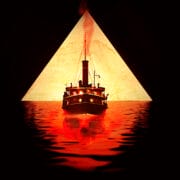A steamship sails on red water toward a glowing pyramid, with its reflection visible on the surface and smoke rising from its smokestack.