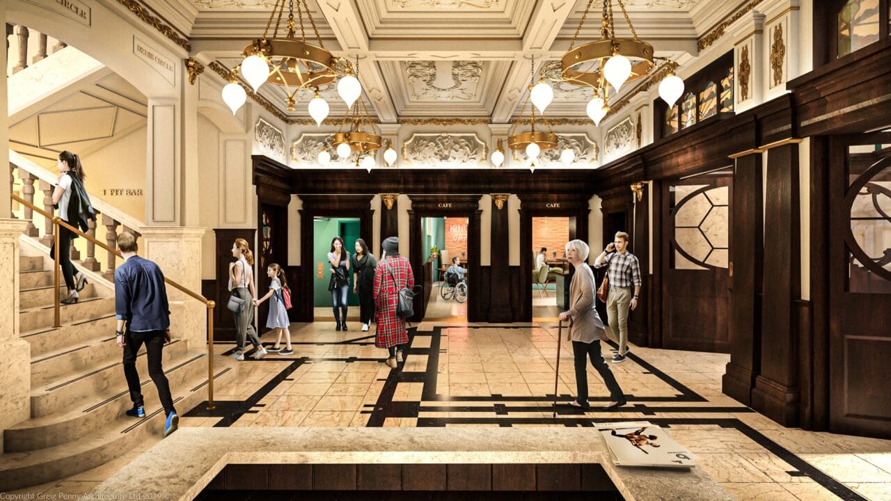 A spacious, ornate building lobby with marble floors, people walking and talking, a staircase on the left, large chandeliers, and decorative columns and ceiling moldings.