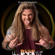 A man with long hair and tattoos wears a sleeveless maroon shirt, sticking out his tongue and making rock hand gestures. Text above reads "BRIT Ryan Livingstone," promoting the electrifying "We Will Rock You" event at bloc, 25-28 Feb 2026.