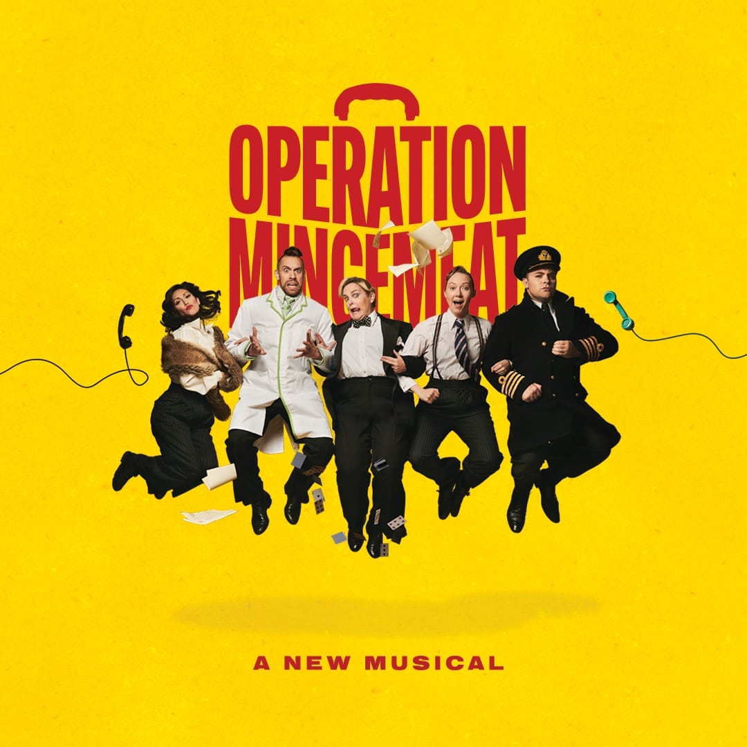 Five actors in various costumes leap in front of a yellow backdrop, with "Operation Mincemeat: A New Musical" boldly displayed above them.