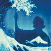 A person’s silhouette holding a brush appears against a background resembling Hokusai's Great Wave, with stylized waves and Mt. Fuji visible.