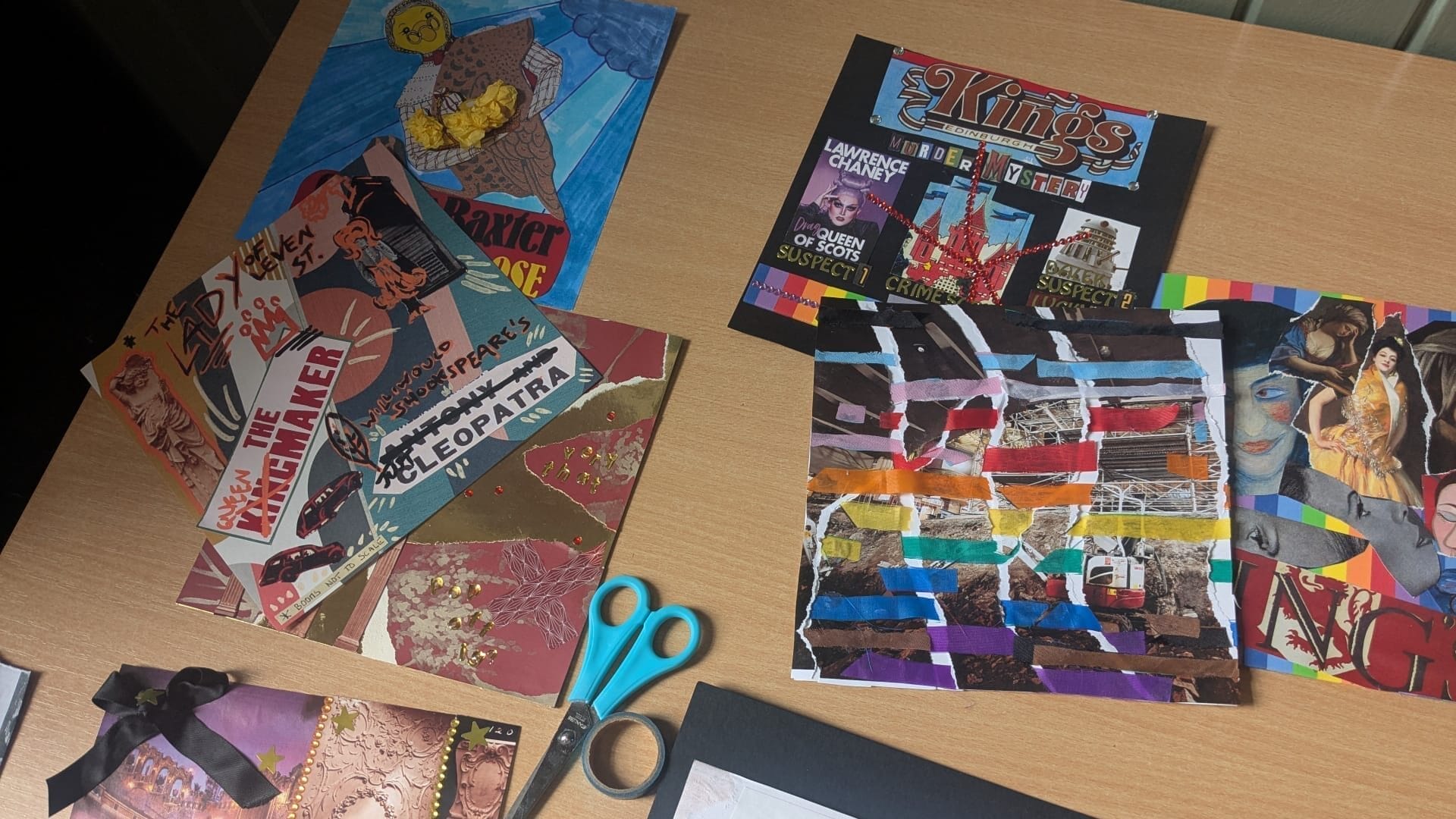 A desk with colorful collage artworks, scissors, and paper scraps arranged on its surface, from creative workshops with the King's Theatre Heritage Project in collaboration with LGBT Youth Scotland.