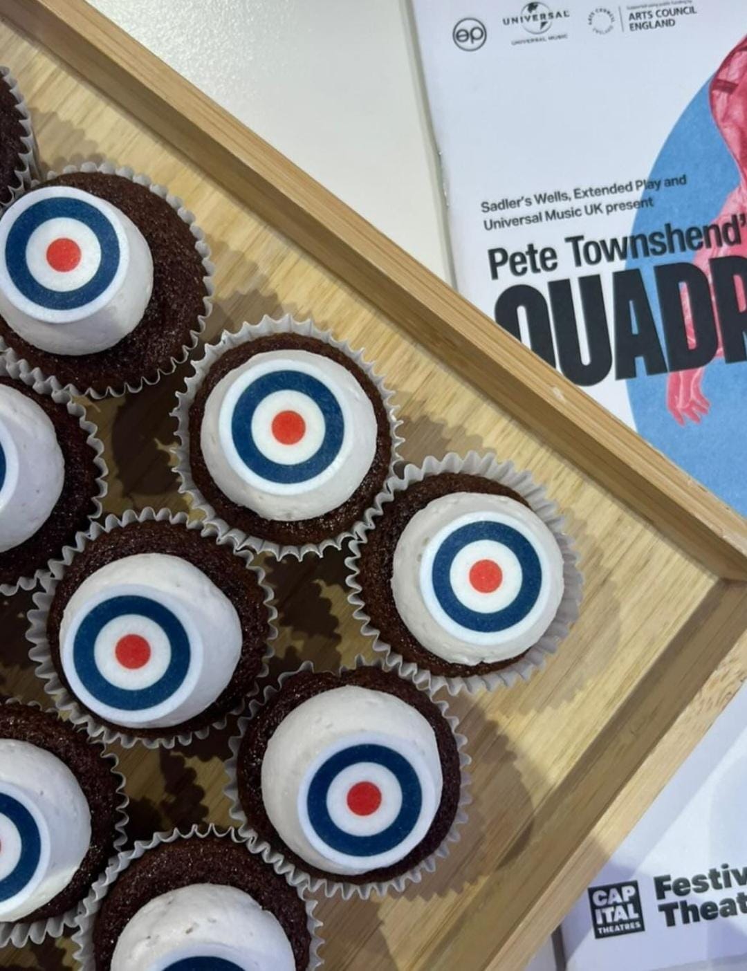 A picture of some Quadrophenia-themed cupcakes, with the programme of Quadrophenia in the background.