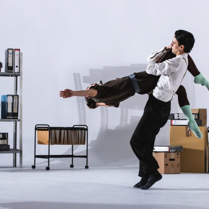A man carrying a woman in the air.