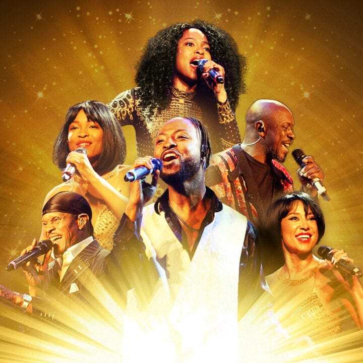 Six singers perform energetically on stage against a golden, radiant background, each holding a microphone and wearing formal or performance attire, bringing the Story of Soul to life with every note.