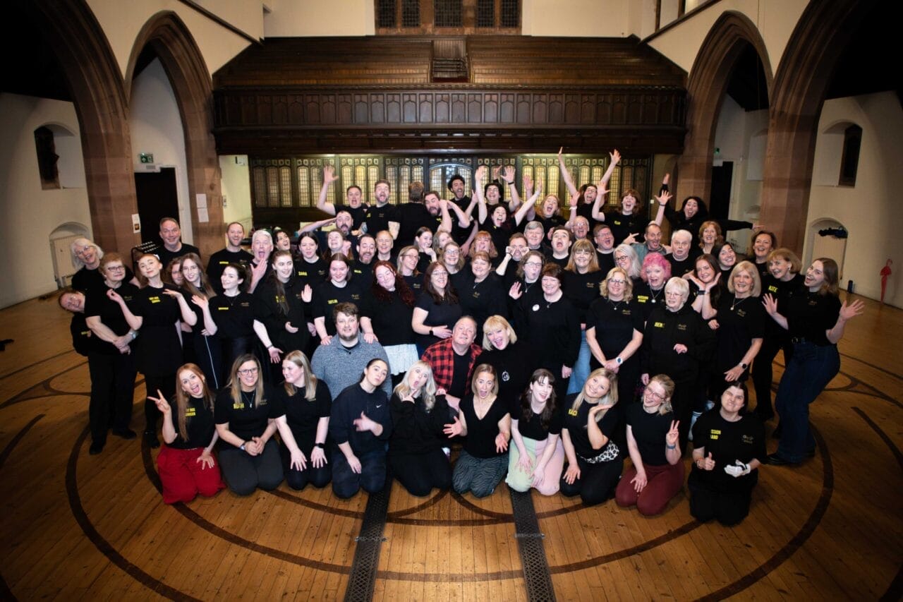 A large group of people smiling